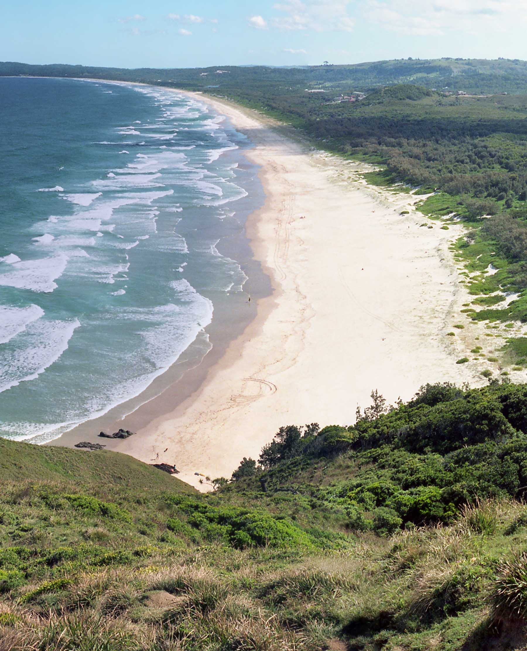 View of pedestrian in the distance at Tallow Beach.