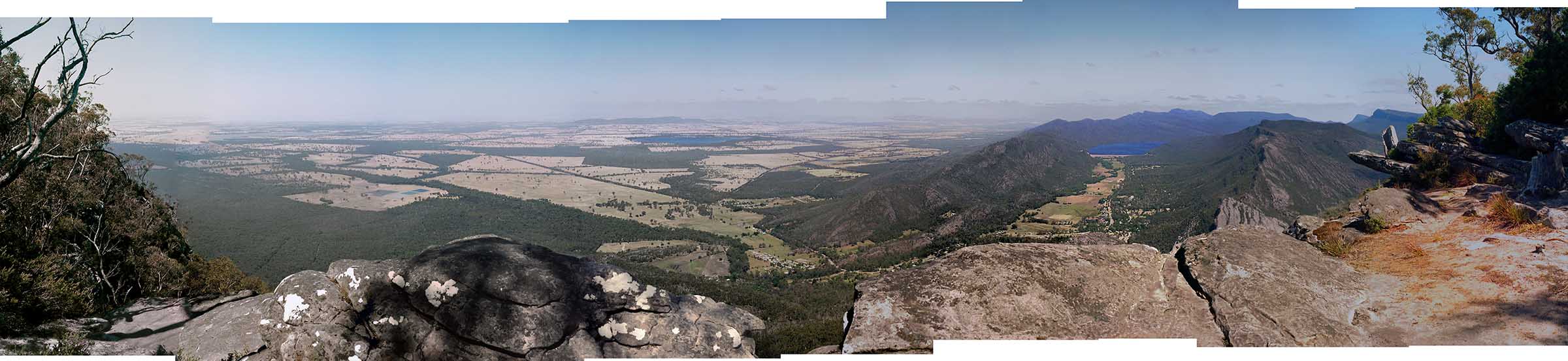 View of the town of Halls Gap and countryside below from the Boroka Lookout at Grampians National Park.