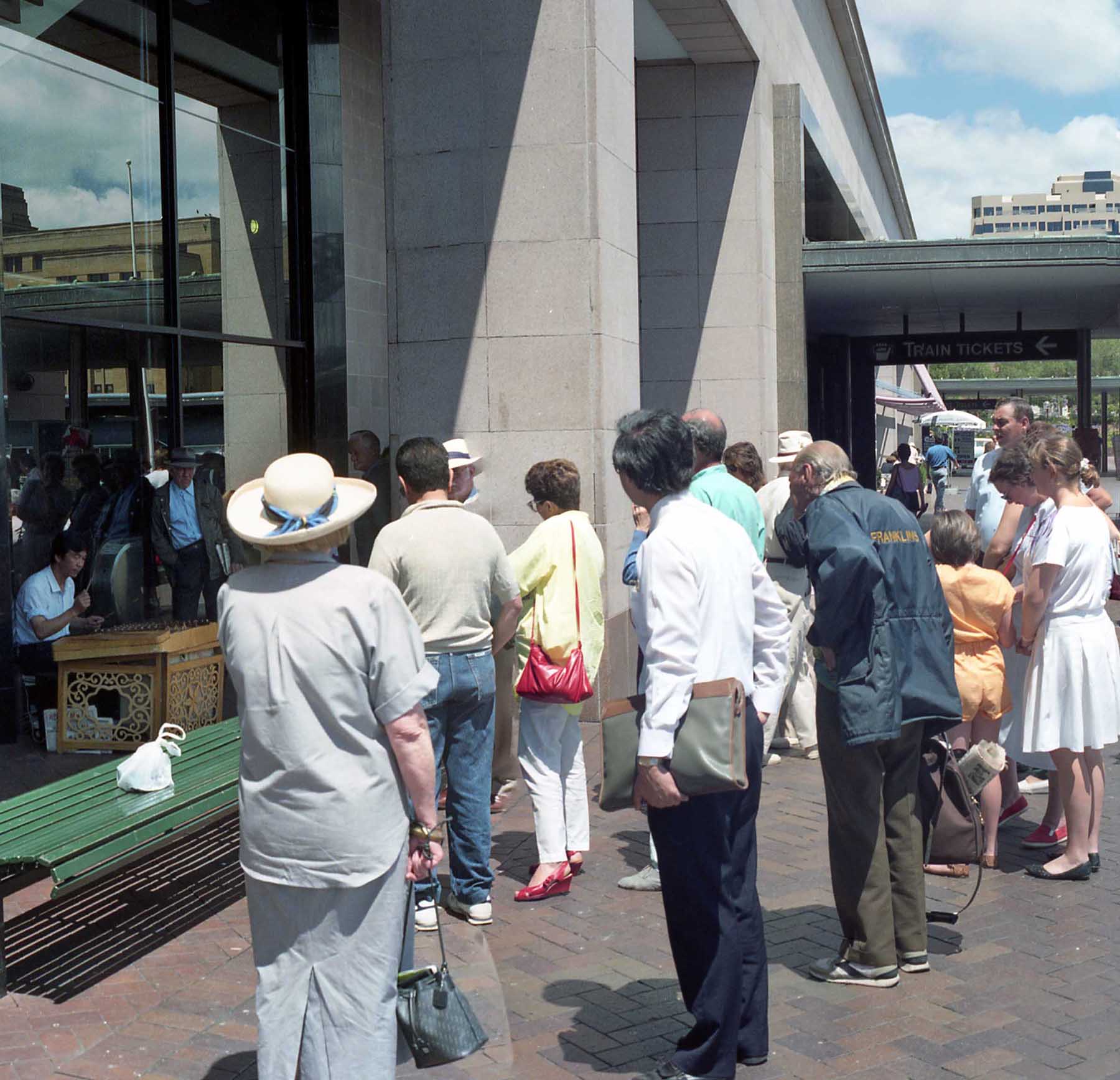 View of onlookers checking out the music at Circular Quay on a warm December day